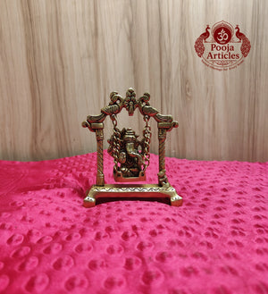 Premium Brass Ganesha on Jhula Swing Statue 4.2 Inch - Front view showing Ganesha seated on ornate peacock swing